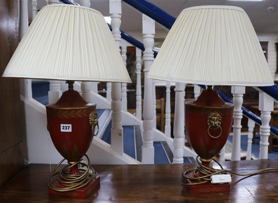 A pair of Regency style red and gilt lamp bases 38cm to fitting